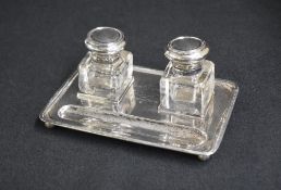 A George V silver inkwell stand, of rectangular form having thread rim, having personal engraving to