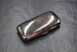 A Victorian silver cigar case, of hinged rectangular form curved for the gentleman's pocket, marks