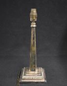 An early 20th century Walker & Hall silver plated lamp base, the step moulded square base with