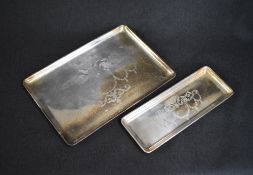 A George V silver pin tray, of rectangular form having decorative scroll and floral swag engraving