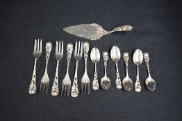 A set of twelve white metal Hildesheimer Rose cake forks and teaspoons, having decorative pierced