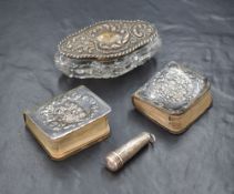 Two silver mounted books of common prayer, having embossed cherubs to the covers, along with a