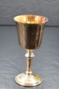 A cased Elizabeth II silver cup, of traditional form having a slightly flared rim, gilted interior