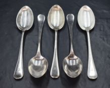 A group of five Victorian silver Hanoverian pattern spoons, having an initial engraved to the