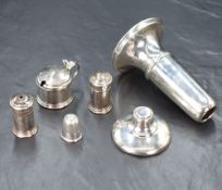 A cased George V silver condiment set, comprising a salt, pepperette and mustard, marks for