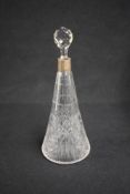 An Edwardian silver mounted cut glass decanter, of circular form having a moulded circular