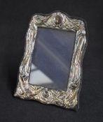 An Elizabeth II silver mounted photograph frame, of rectangular form with decorative interwoven