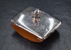 An early 20th century silver mounted ink blotter, of traditional form having a wooden body with a