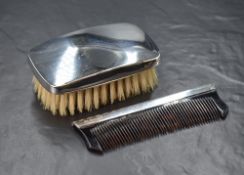 An Elizabeth II silver mounted gentleman's hair brush, of plain rectangular form, along with a