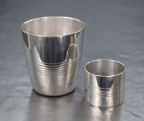 A 20th century Egyptian silver beaker, of traditional form having engraved linework to the body,