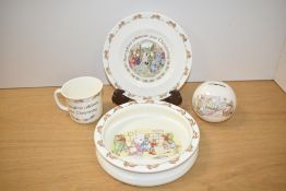 A Royal Doulton Bunnykins Christening plate, h20cm, sold together with a Bunnykins mug, piggy bank