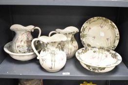 A 20th century Japanese Satsuma jug and bowl decorated with gilt edging and floral patterns, gold