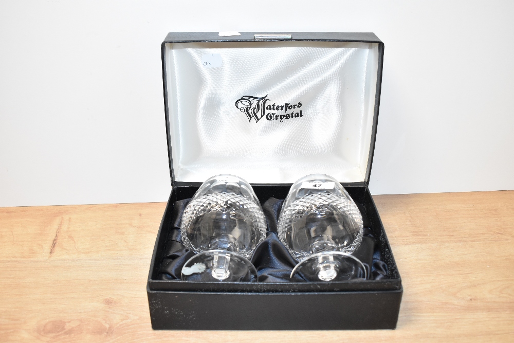A pair of Waterford coleen pattern cut crystal brandy glasses with original box, paper label to