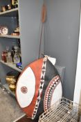 An African shield hand coloured with geometric patterns on a Buffalo-skin ground, h100cm, sold