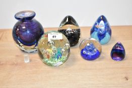 A vintage studio glass paperweight with butterfly and bubble decoration, h9cm, sold together with
