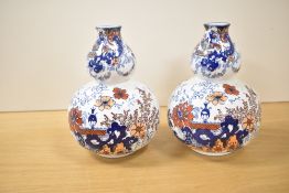 A pair early 20th century Ridgway pottery vases of double gourd form, decorated in the Japanese