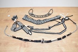 A collection of African beaded necklaces, having porcupine quill decoration