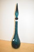 A mid-century teal green Empoli glass bottle decanter, measuring 57cm overall.