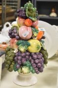 A mid-century porcelain fruit tree centrepiece sculpture having white urn containing a bouquet of