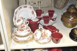 A Royal Albert Crown China part tea service, hand coloured in foliage on an ice white ground, makers