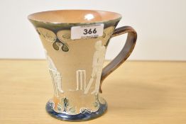 A late 19th century Doulton Lambeth stoneware mug decorated depicting cricket scenes surrounded by