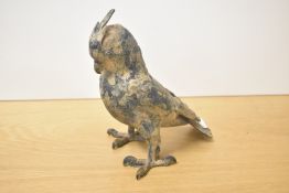 A 20th century Japanese cast and patinated metal bird study having sharp hook claws, impressed