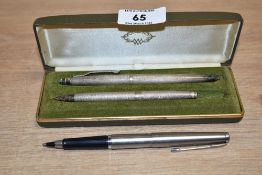 A Swiss hallmarked silver ball point pen, L13cm sold together with case, a similar ball point pen