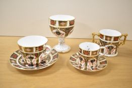 A Royal Crown Derby Imari 1128 pattern cup and saucer, h7.5cm, sold together with a coffee cup and