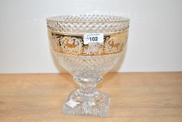 An early 20th century cut glass bowl, having acid-etched floral decoration on a gilt ground,