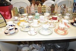 An assortment of miscellaneous cups and saucers to include Paragon Bone China 'Tapestry Rose', Foley