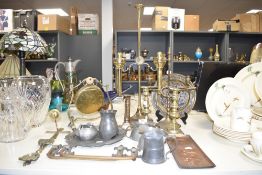 A brass double arm candlestick having adjustable height mechanism, h60cm, sold together with a