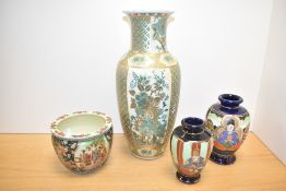 A large Japanese vase in baluster form decorated with exotic birds in green and gilt colour,