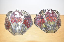 A pair of Tiffany style pendent wall lights decorated with red, pink and green colour glass, width