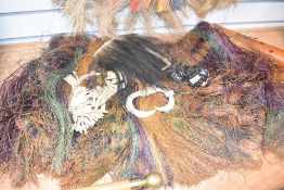 A pulpus grass skirt from Papua New Guinea, L 70cm, sold together with various teeth and seed jewel