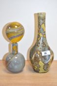 A stoneware bottle vase decorated with green mossy patterns on a glaze ground, h25cm, sold