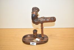 A early 20th century Henry Howell & Co for Dunhill smokers companion having stylised bird