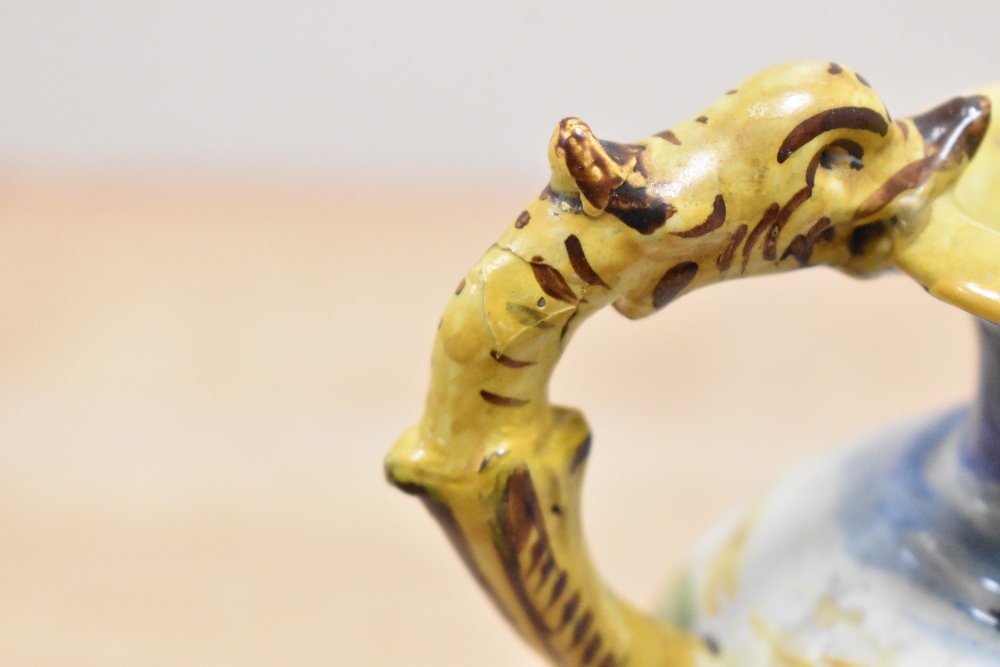 A Majolica style vase decorated with multiple colour glazes and fish form handles, supported on - Image 4 of 4