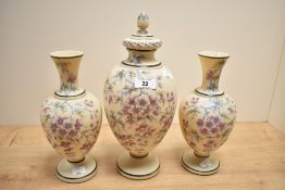 A late 19th Royal Bon style lidded vase hand painted with floral patterns and gilt edging, h32cm,