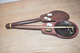 A 19th century opium scale with brass fittings and counter balance weight, housed in a fitted hinged