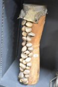 A vintage Papua New Guinea wooden drum musical instrument having snakeskin top and decorated with s