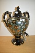 A splendid 19th century Jackfield Jetware lustre samovar on a flared hollow foot with two scroll
