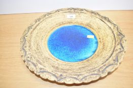 A large studio pottery bowl, the pinched edge decorated with geometrical patterns, the bottom having