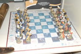A 32 piece Walt Disney chess board to include figures such as Minnie Pluto Goofy and Micky Mouse,