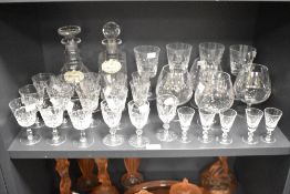 A cut crystal decanter of baluster form having stopper and enamel sherry label, h23cm, sold together
