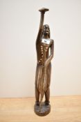 A hand carved wooden sculpture of a man with spear and shield, h50cm