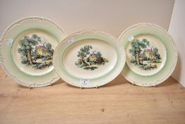 A Clarice Cliff Cotswold Newport pattern oval dish having country scene and gilt edging, w28cm, sold