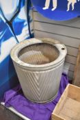 A large galvanised dolly tub having textured rib pattern, the top with impressed mark reading 'Non