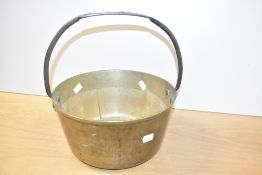 A early 20th century brass jam pan with iron handle, width 27cm