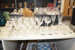 A large assortment of cut crystal glass including decanters, whisky glasses, bowls etc.