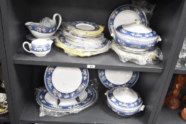 A Wedgwood Blue Siam pattern fine bone china dinner service, decorated with floral patterns and gilt